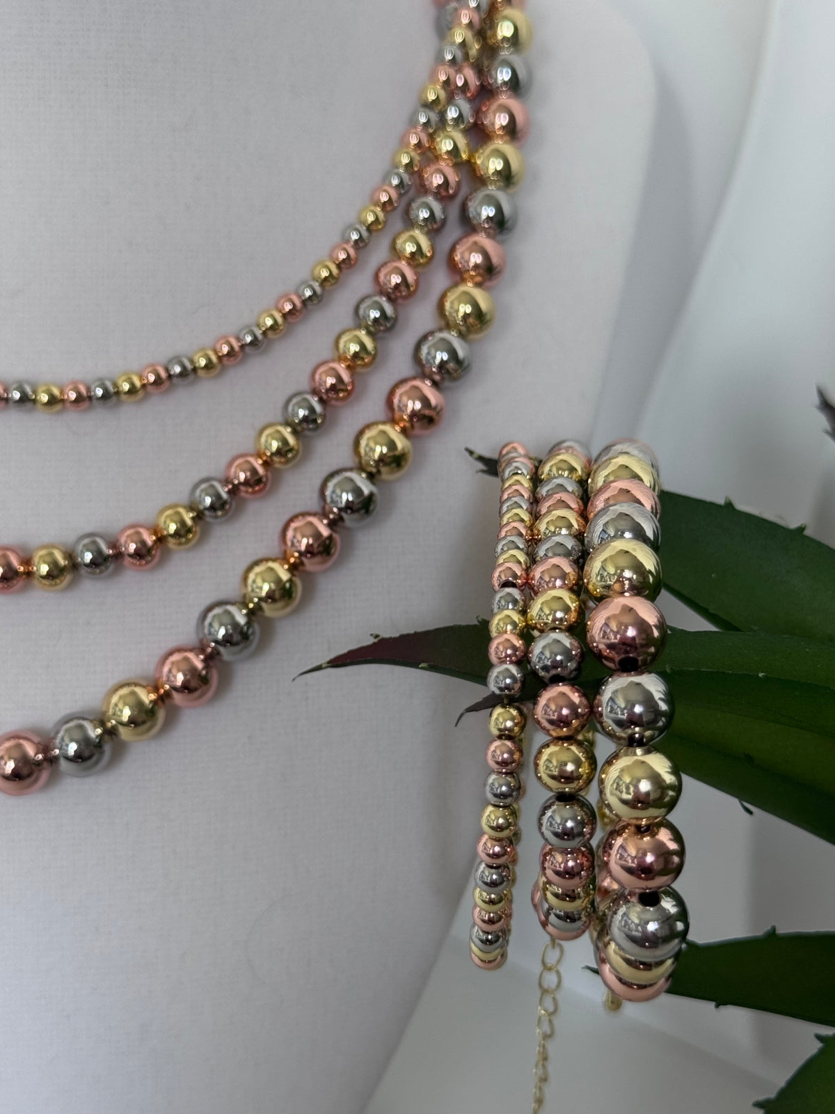 Three-tone beaded necklace with gold silver-tone and rose gold-tone round beads available in 4mm 6mm and 8mm sizes