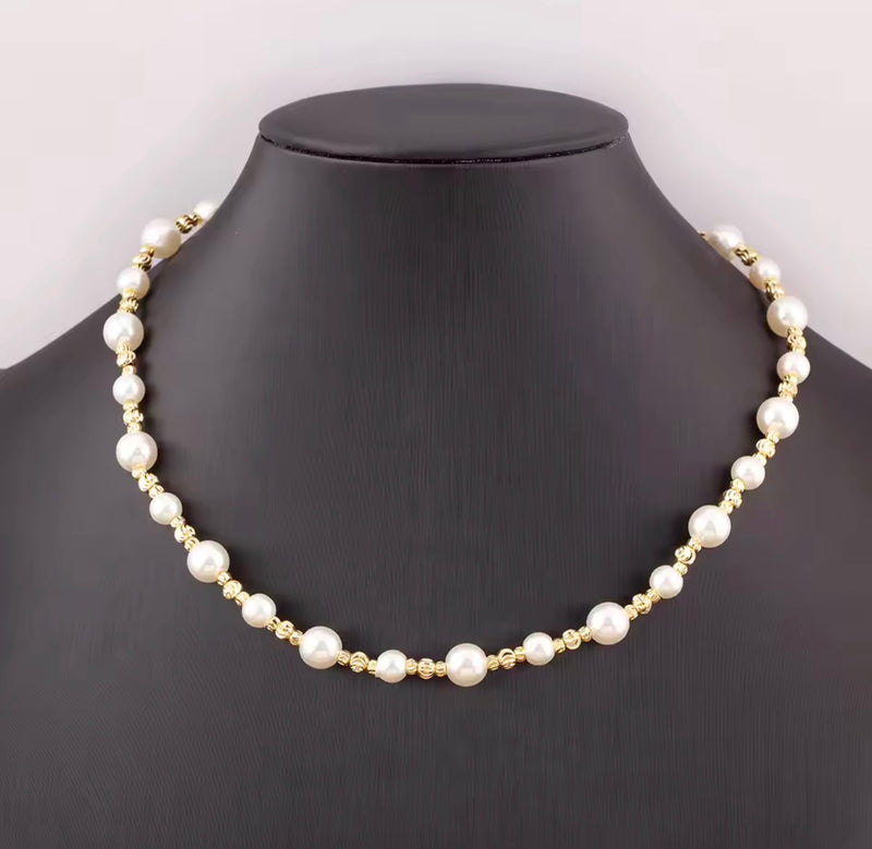 Three styles of synthetic pearl necklaces with 18K gold plated beads including oval pearl round pearl and heart pearl designs