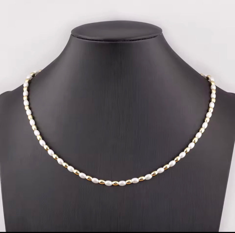 Three styles of synthetic pearl necklaces with 18K gold plated beads including oval pearl round pearl and heart pearl designs