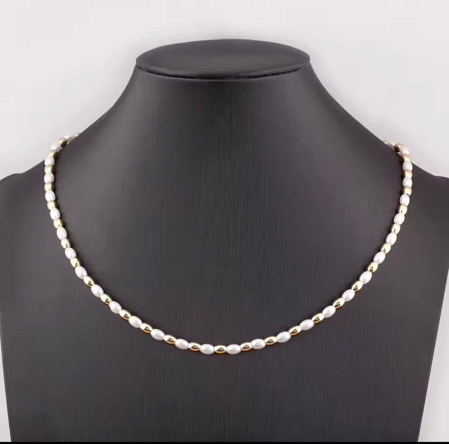 Three styles of synthetic pearl necklaces with 18K gold plated beads including oval pearl round pearl and heart pearl designs