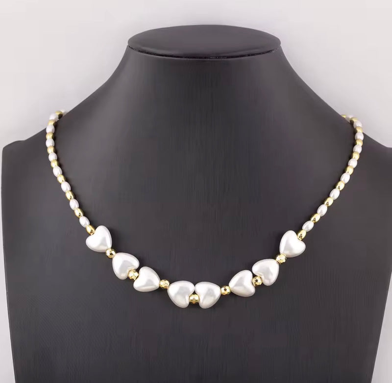Heart shaped synthetic pearl necklace with 18K gold plated beads and adjustable chain