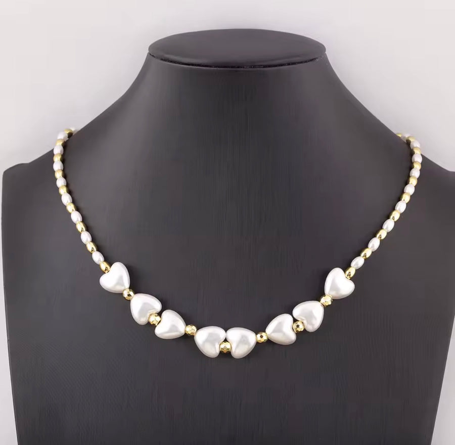 Heart shaped synthetic pearl necklace with 18K gold plated beads and adjustable chain