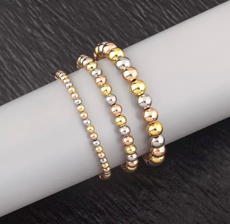 Three-tone beaded necklace with gold silver-tone and rose gold-tone round beads available in 4mm 6mm and 8mm sizes