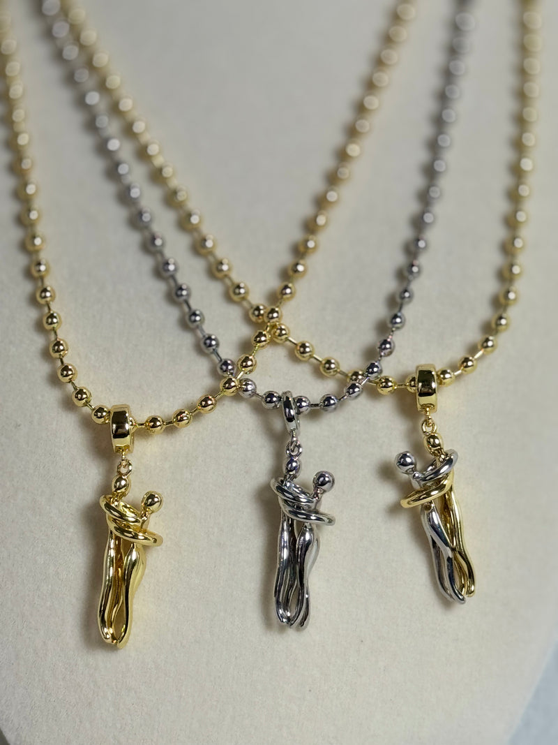 18K gold plated 3mm beaded necklace with hugging couple motion pendant in gold, silver-tone and two-tone