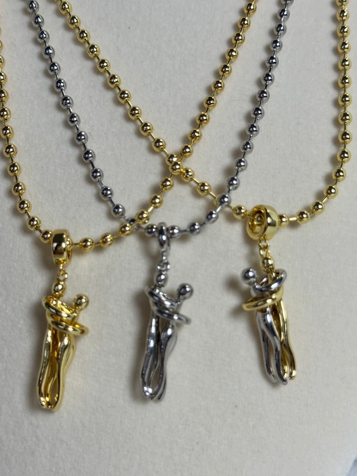 18K gold plated 3mm beaded necklace with hugging couple motion pendant in gold, silver-tone and two-tone