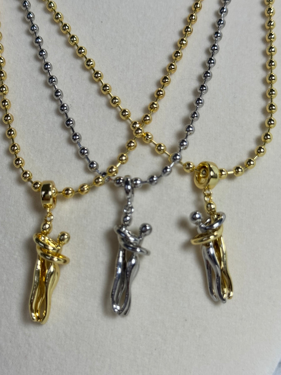 18K gold plated 3mm beaded necklace with hugging couple motion pendant in gold, silver-tone and two-tone