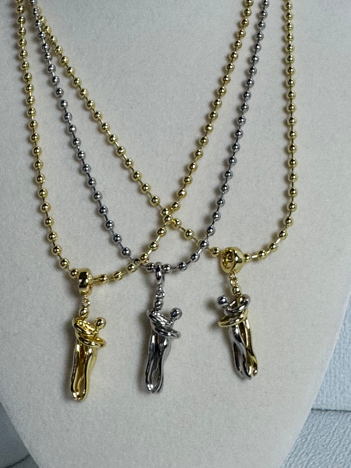 18K gold plated 3mm beaded necklace with hugging couple motion pendant in gold, silver-tone and two-tone