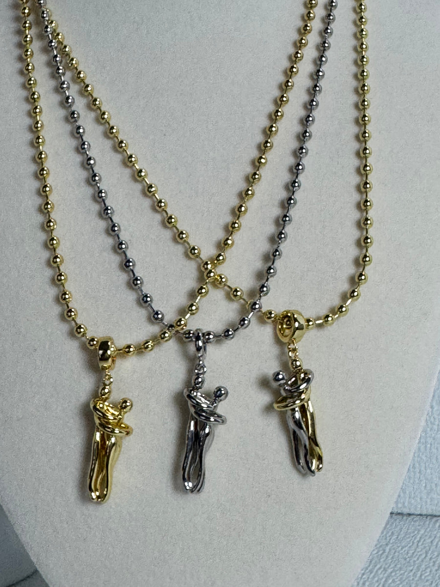 18K gold plated 3mm beaded necklace with hugging couple motion pendant in gold, silver-tone and two-tone