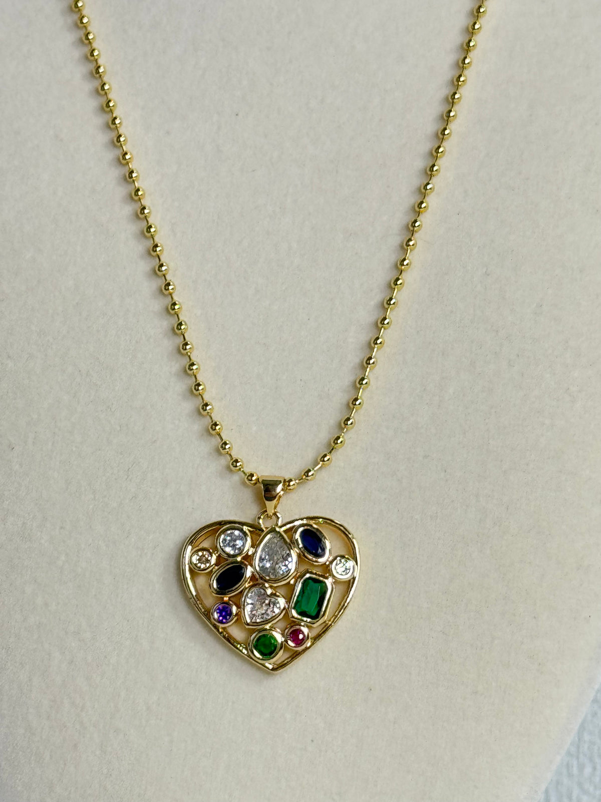 18K gold plated multicolor stone heart pendant necklace with colorful green blue purple pink and clear stones on a 2mm beaded chain