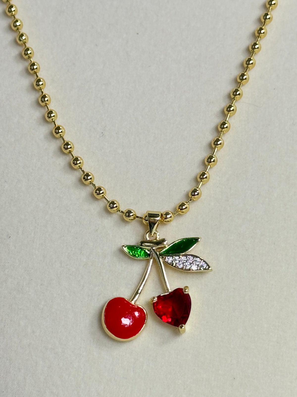 18K gold plated red cherry pendant necklace with green leaf accents and 3mm beaded chain