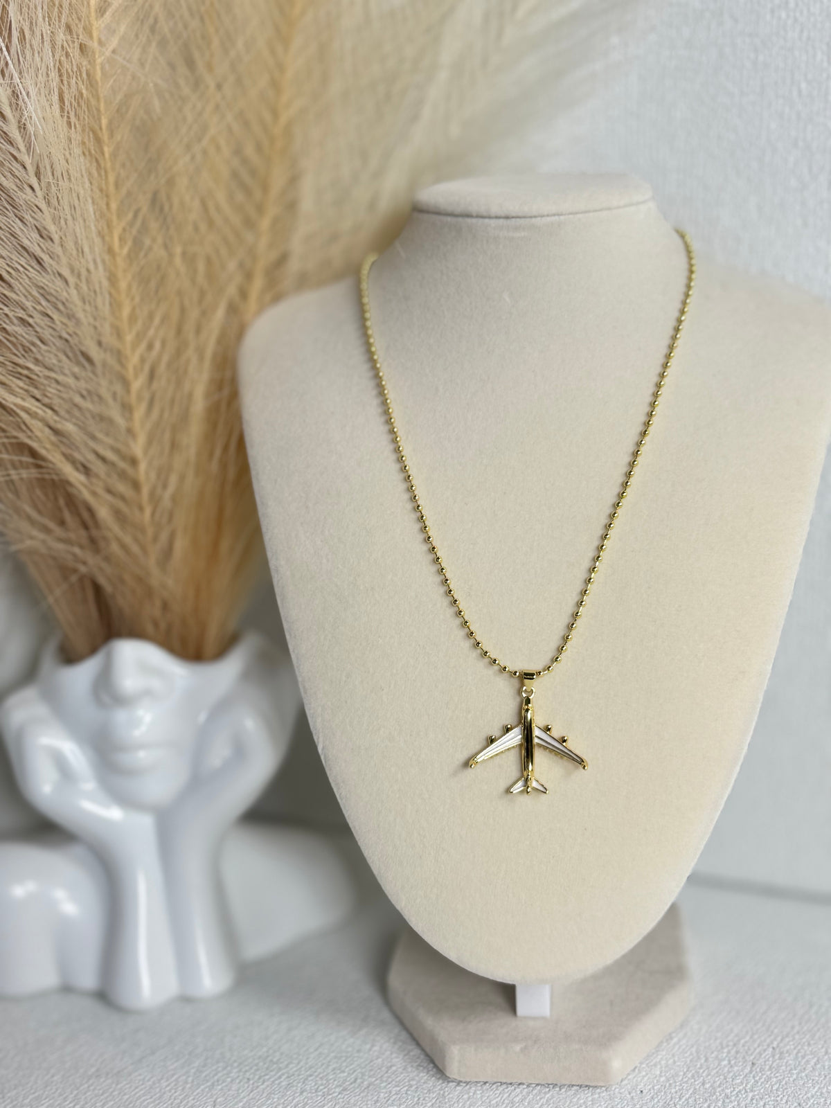 18K gold plated airplane pendant necklace with detailed wing accents and 2mm beaded chain