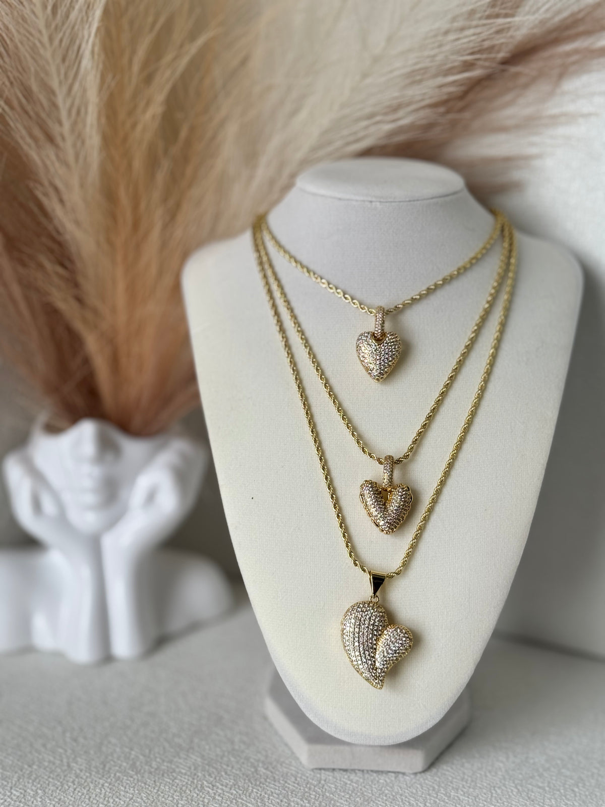 Three 18K gold plated rope chain necklaces with sparkling pavé zirconia heart pendants in different styles