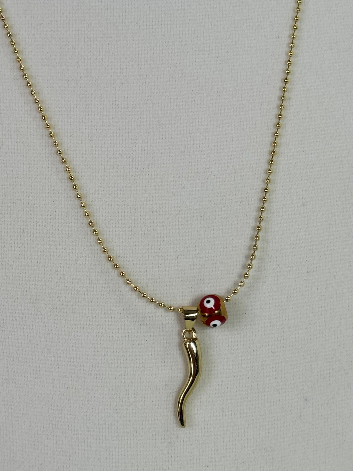 Red and gold cornicello horn necklaces with eye-detail beads on 18K gold plated 1.5mm chains
