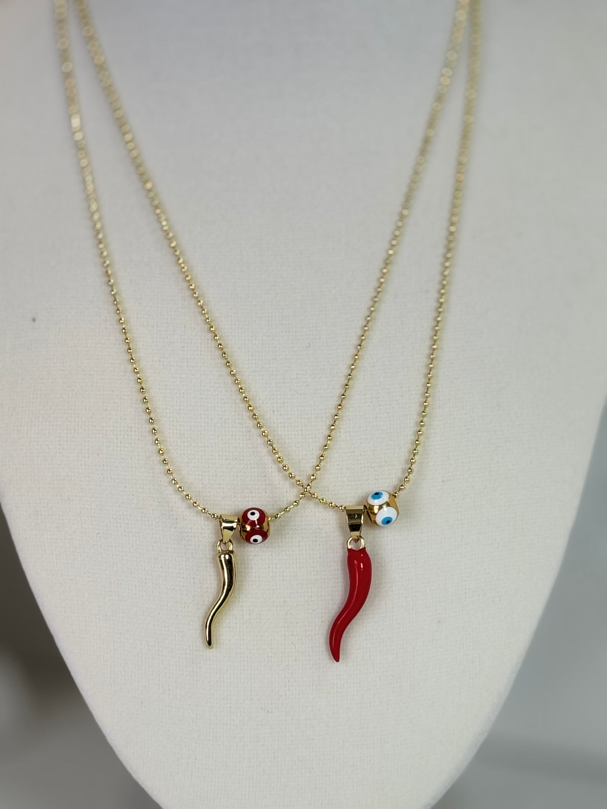 Red and gold cornicello horn necklaces with eye-detail beads on 18K gold plated 1.5mm chains