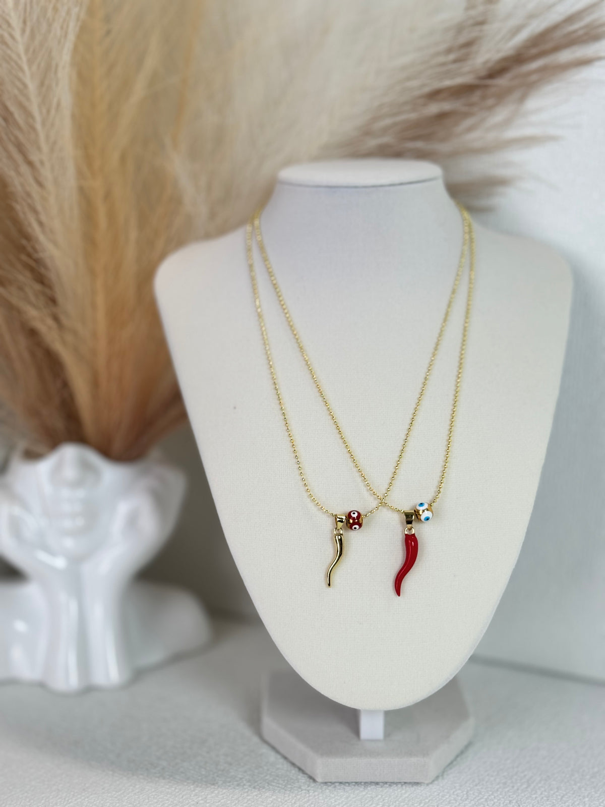 Red and gold cornicello horn necklaces with eye-detail beads on 18K gold plated 1.5mm chains
