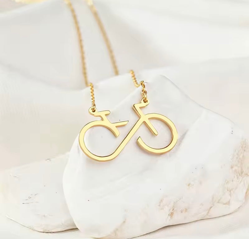 Infinity bicycle pendant necklace in stainless steel available in gold and silver