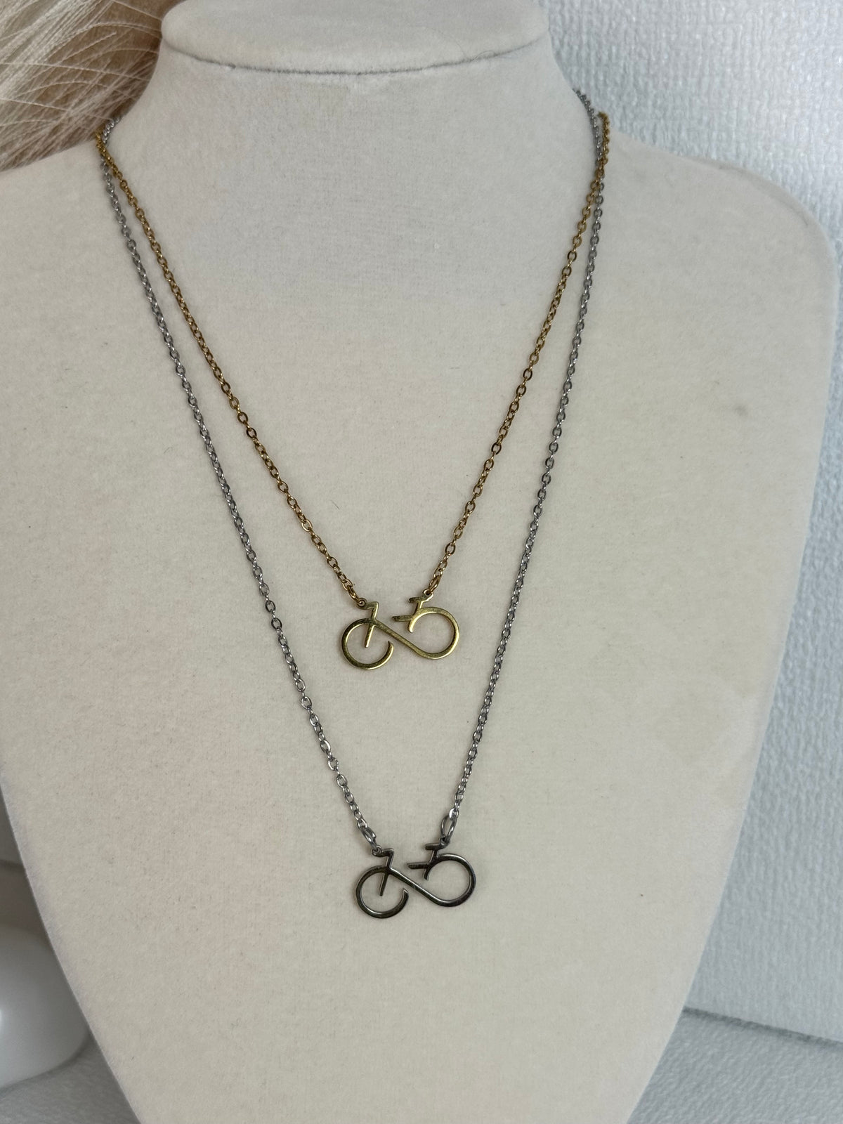 Infinity bicycle pendant necklace in stainless steel available in gold and silver