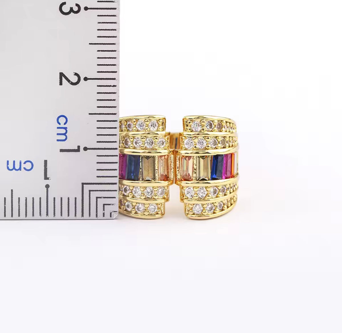 Gold tone open statement ring with baguette stones and clear cubic zirconia