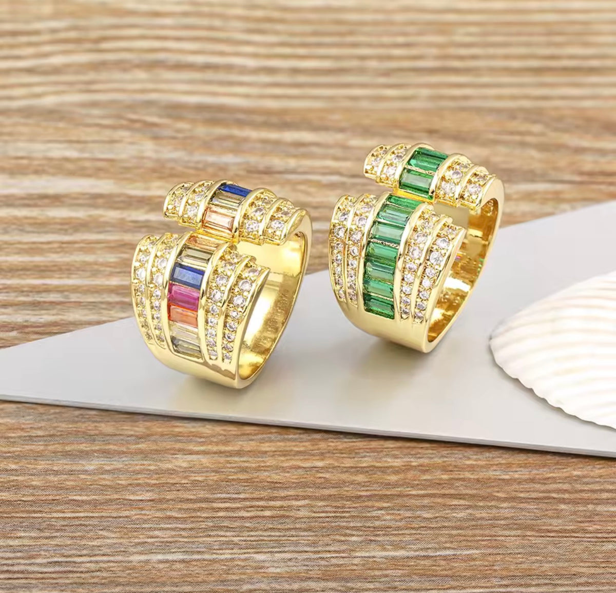 Gold tone open statement ring with baguette stones and clear cubic zirconia