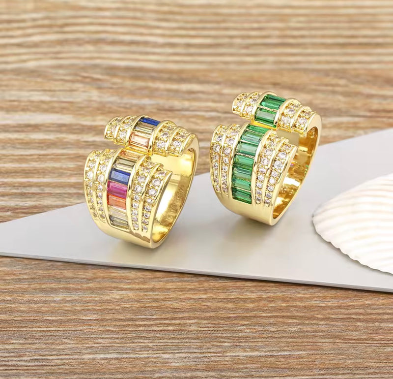 Gold tone open statement ring with baguette stones and clear cubic zirconia
