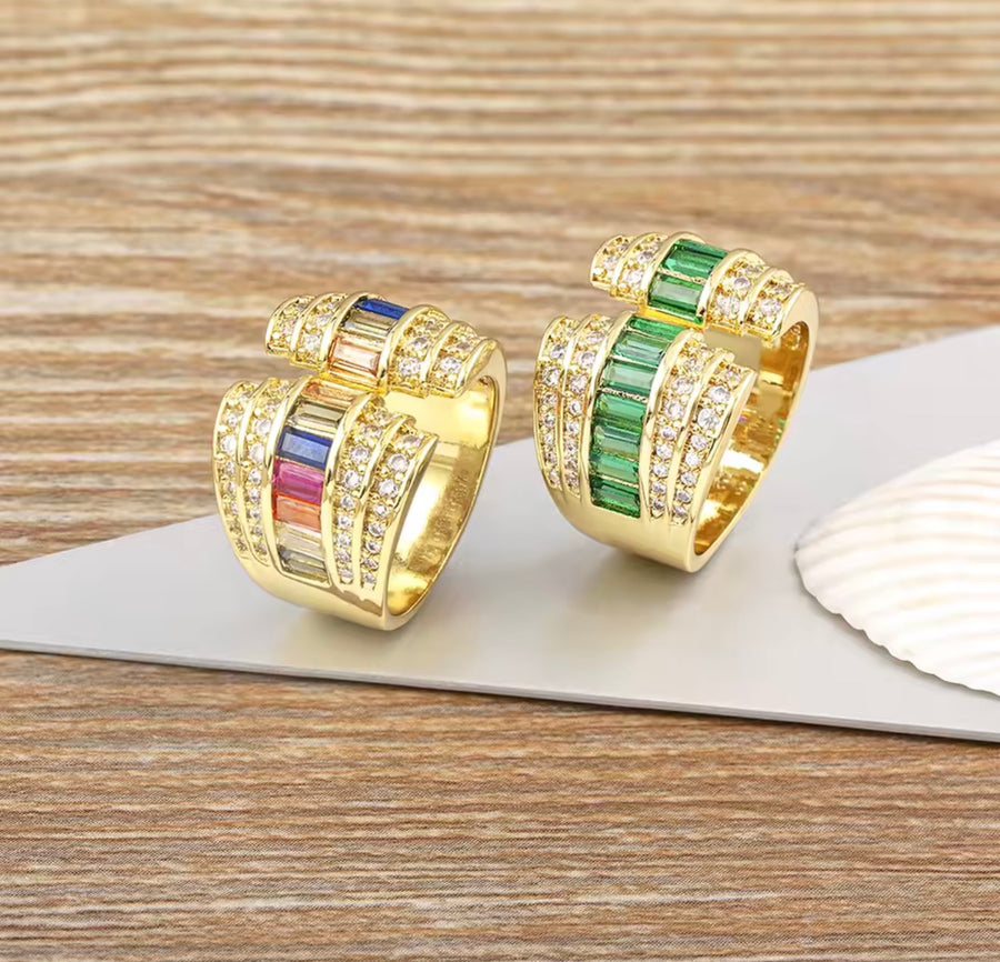 Gold tone open statement ring with baguette stones and clear cubic zirconia