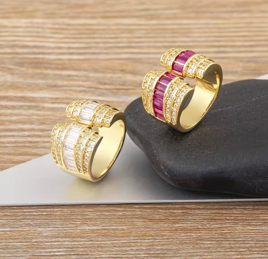 Gold tone open statement ring with baguette stones and clear cubic zirconia